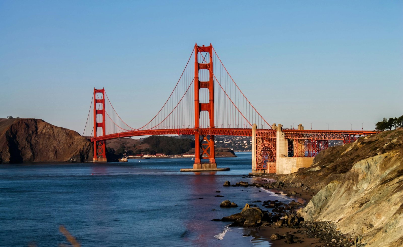 Breathtaking view of the Golden Gate Bridge in San Francisco with a tranquil ocean background.
