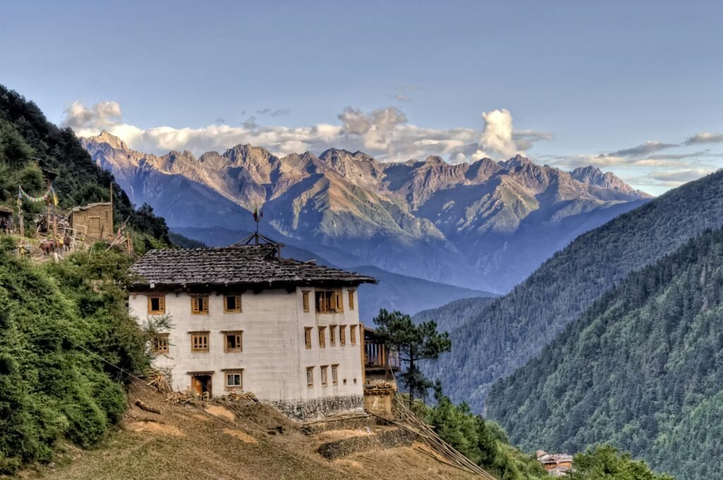 Majestic mountains and traditional architecture in Yubeng Village, Yunnan, China.
