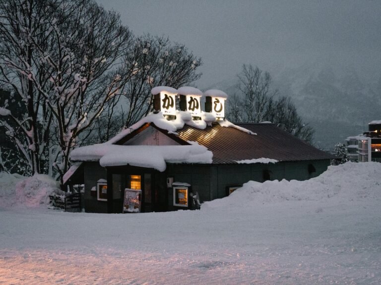 Snow-covered restaurant in snowy winter evening in Niseko, Hokkaido. Charming seasonal scene.